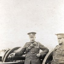 William J. Johnston next to artillery